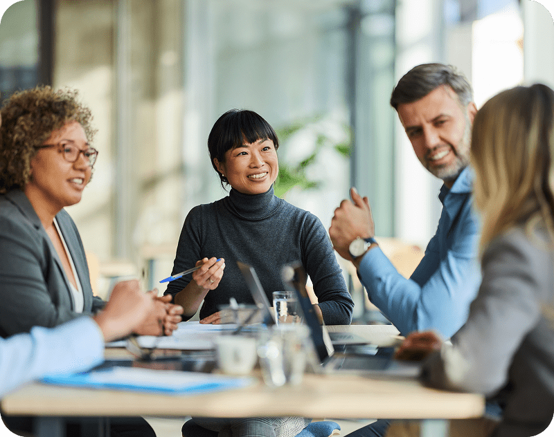 Four people having a business meeting.